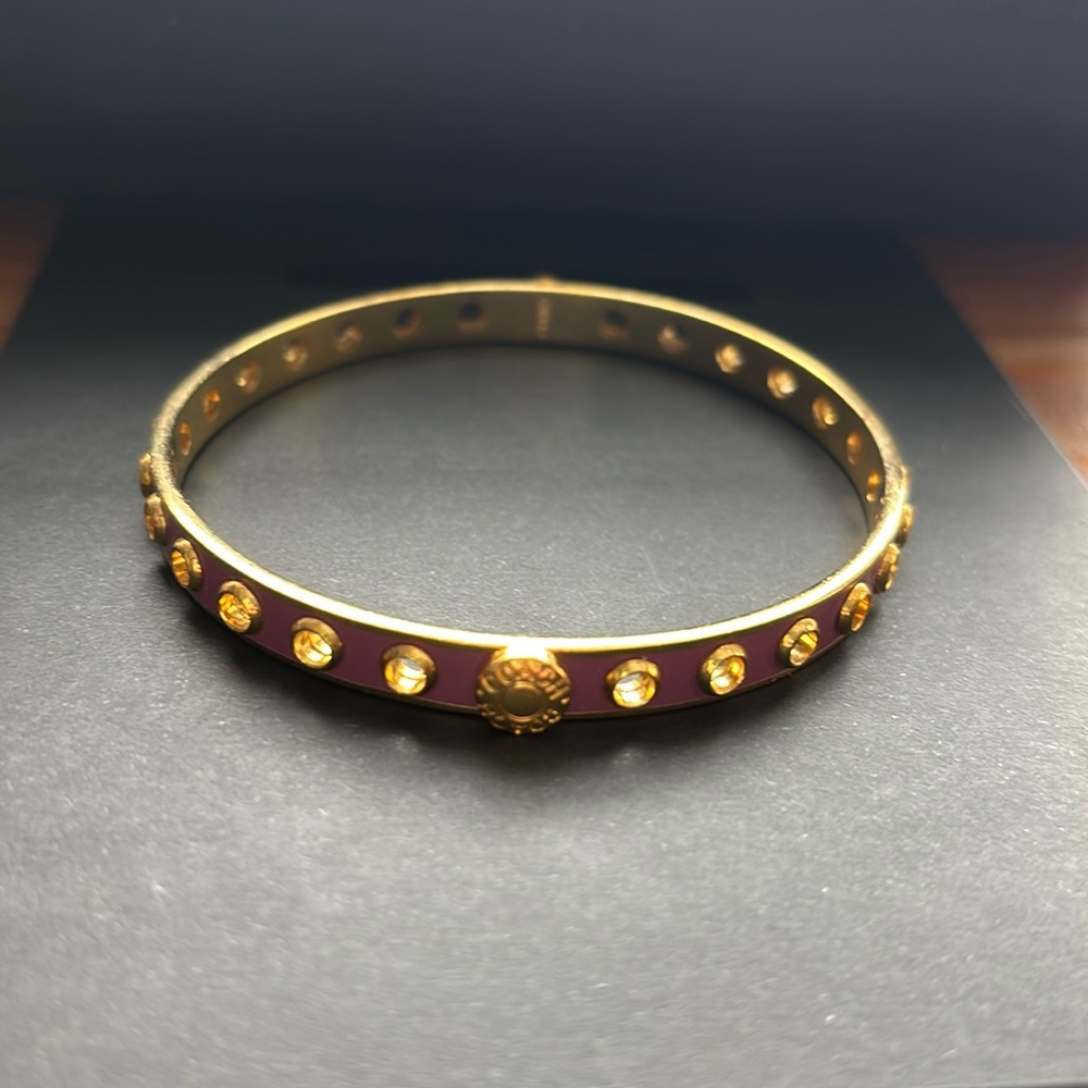 Mint condition gold tone and purple tone coach bangle size 8.5”